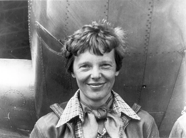 Amelia-Earhart-standing-under-nose-of-her-Lockheed-Model-10-E-Electra-small.jpg
